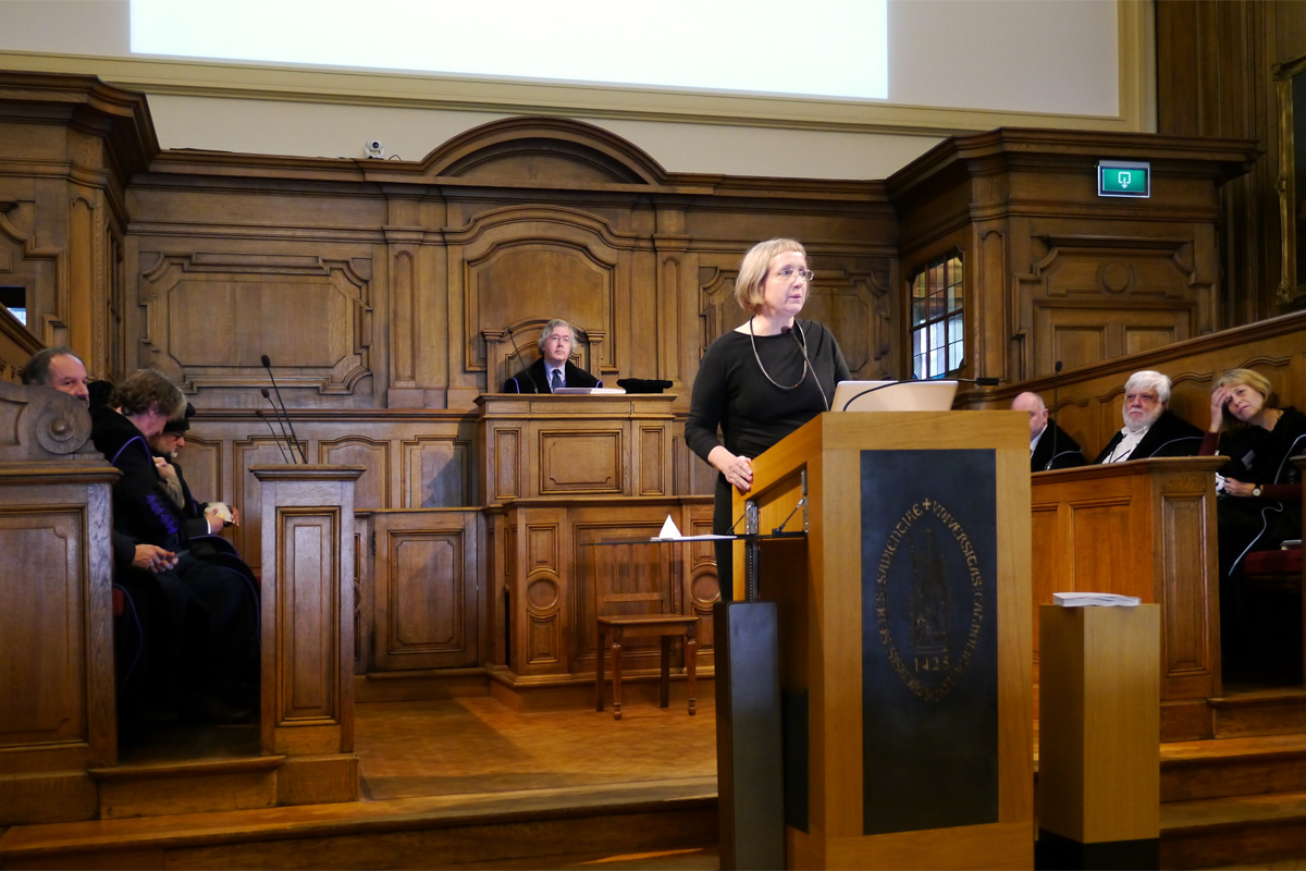 Hannah giving her PhD thesis defense before a distinguished panel of architectural scholars and scholarly architects, Universiteitshalle, Leuven, September 30, 2014. 