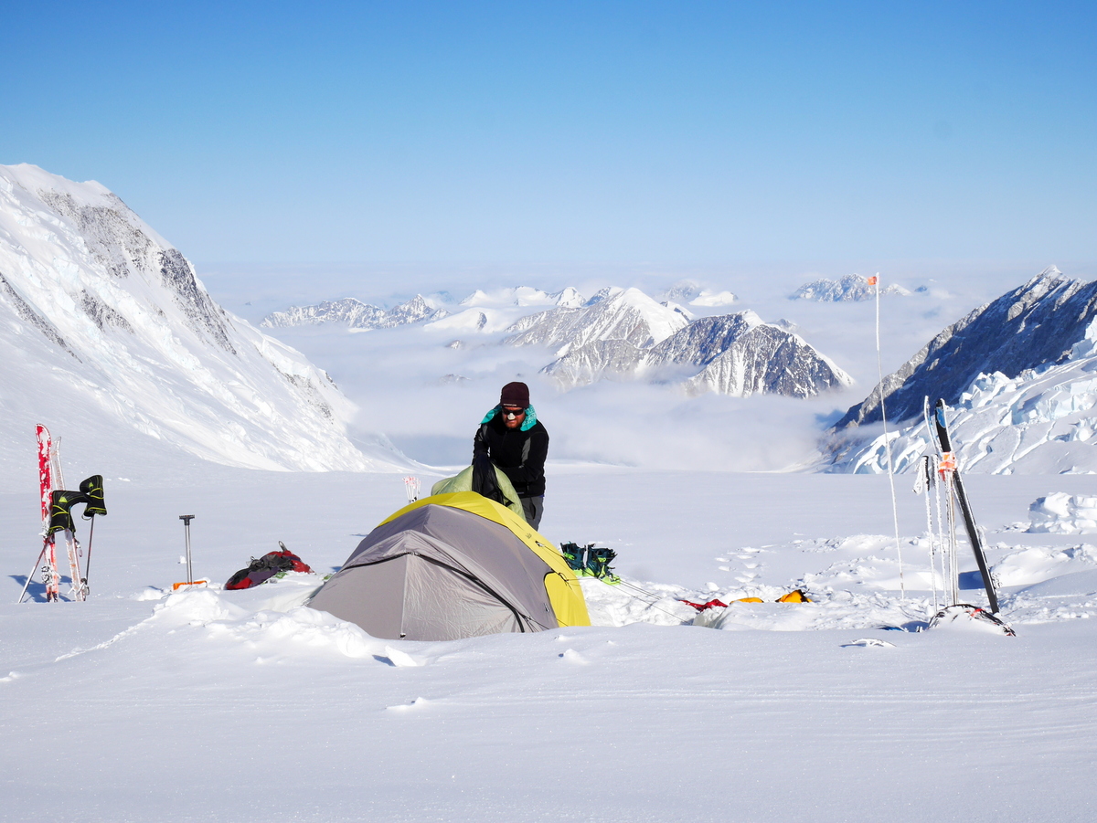 Brian packing up camp at King Col before the long ski down to base camp on the Quintino Sella Glacier.